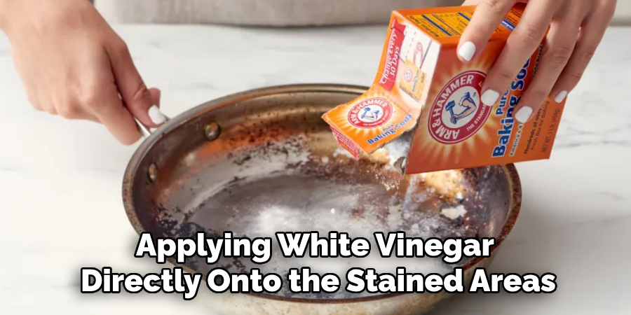 Applying White Vinegar 
Directly Onto the Stained Areas