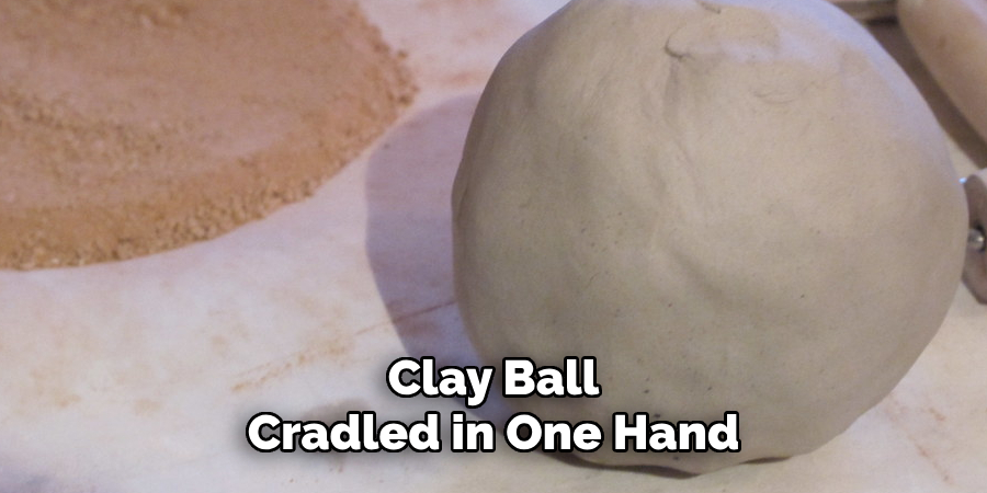 Clay Ball Cradled in One Hand