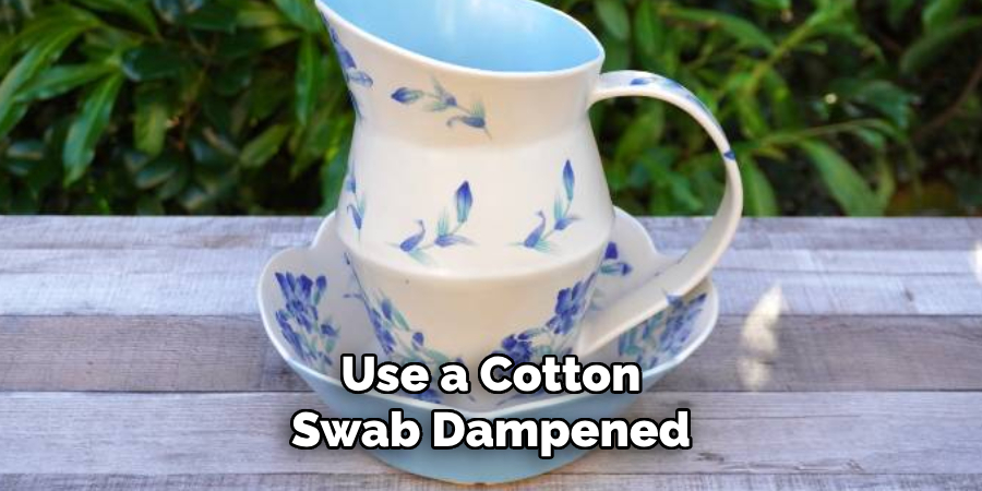 Use a Cotton Swab Dampened